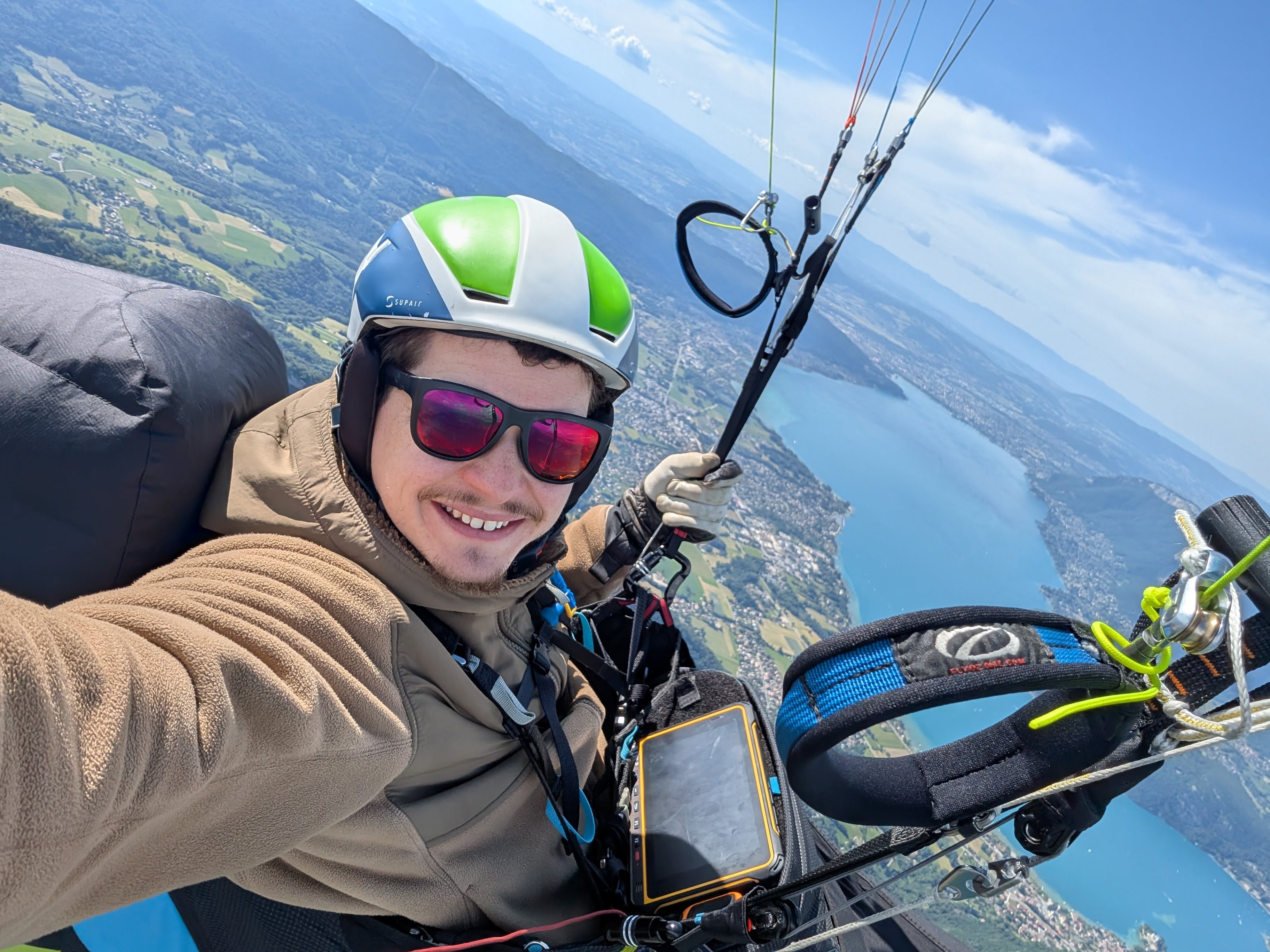 Paragliding over Lake Annecy in the French Alps.